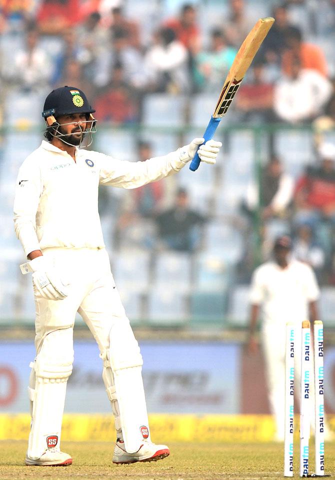 Indian batsman Murali Vijay raises his bat after he completing a half-century (50 runs) during the first day of the third Test cricket match between India and Sri Lanka at the Feroz Shah Kotla Cricket Stadium in New Delhi. Pic/AFP