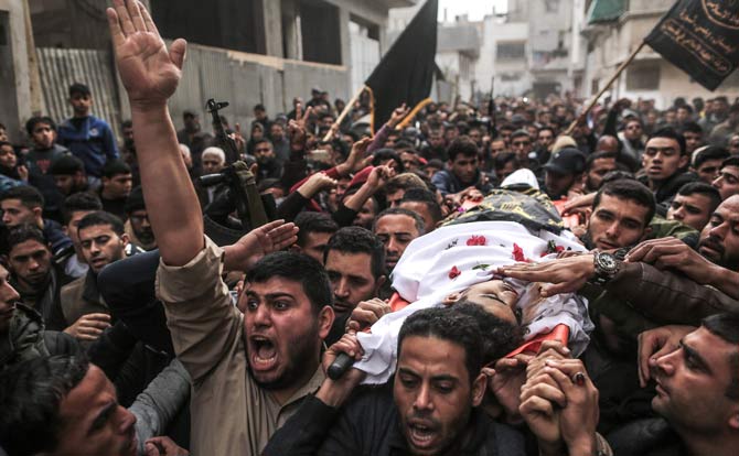 Mourners carry the body of 19-year-old Mohamed Sami al-Dahdouh, a Palestinian youth from Jabalia who was killed in clashes with Israeli forces east of Gaza City, during his funeral in Gaza City. Pic/AFP