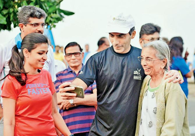 Dr Aashish Contractor takes a selfie with Niranjana Mehta, 84, who came out for a long walk for the first time after her partial hip replacement surgery, on Dec 3. His colleague Dr 