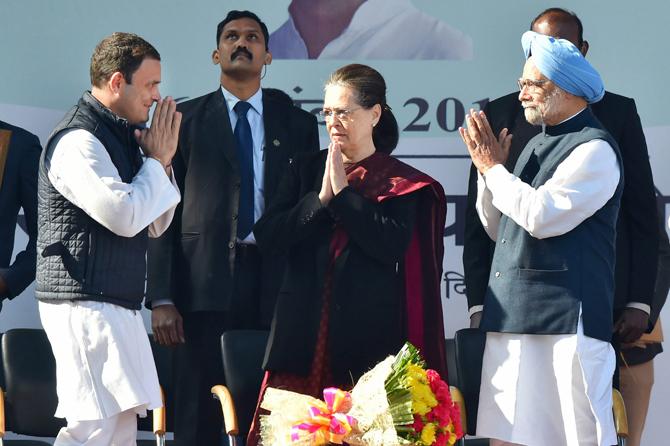 Newly elect Congress president Rahul Gandhi greets his mother and predecessor Sonia Gandhi, and former prime minister Manmohan Singh during a grand event held at the lawns of the All India Congress Committee (AICC) in New Delhi on Saturday. Pic/PTI