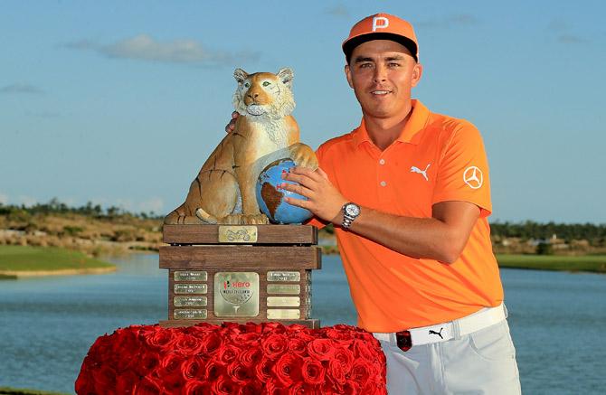 Rickie Fowler of the United States poses with the trophy after winning the Hero World Challenge at Albany, Bahamas on December 3, 2017 in Nassau, Bahamas. Mike Ehrmann/Getty Images/AFP