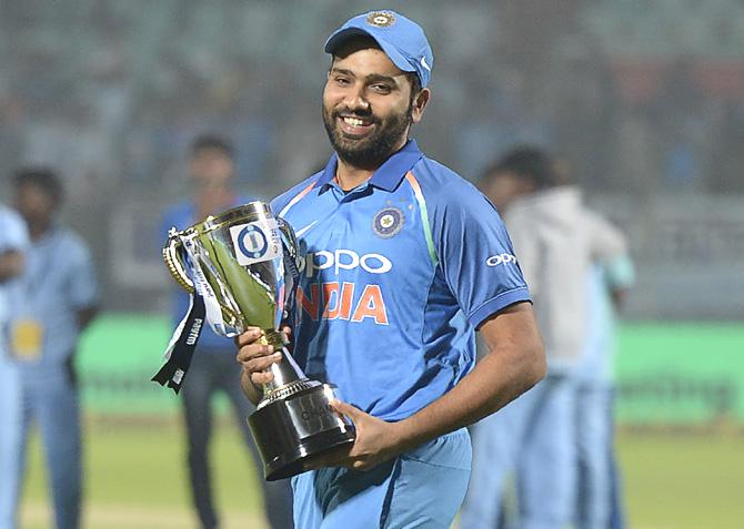 Indian cricket team captain Rohit Sharma looks on as he holds the One Day series cup after wining the third One Day International (ODI) cricket match between India and Sri Lanka at the Dr. Y.S. Rajasekhara Reddy ACA-VDCA Cricket Stadium in Visakhapatnam on December 17, 2017. Pic/AFP