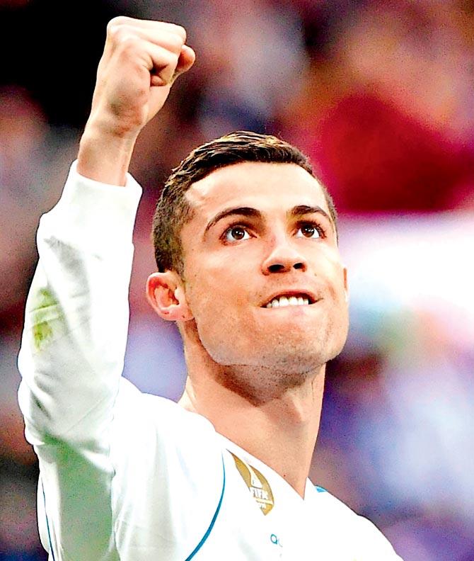 Cristiano Ronaldo celebrates a goal v Sevilla on Saturday. Pic/AFP
