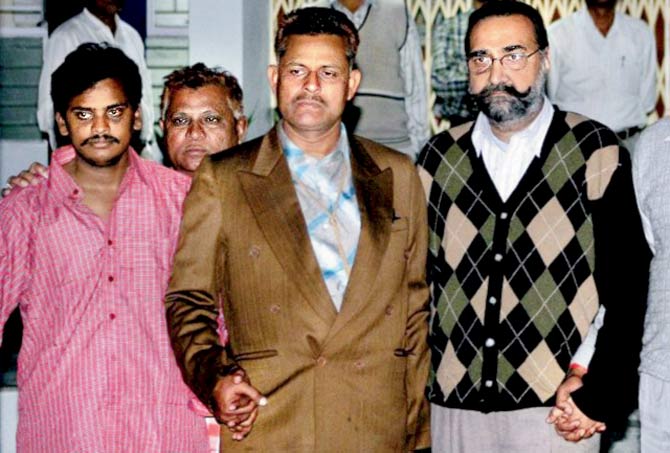 Surinder Koli (in red shirt) and (extreme right) Moninder Singh Pandher. File photo