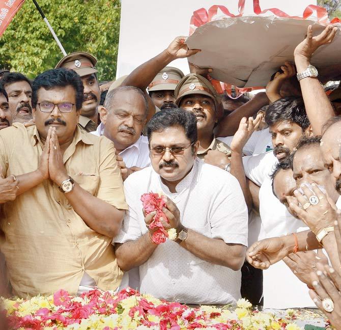 Sidelined AIADMK leader T T V Dhinakaran pays tribute at the memorial of MG Ramachandran after winning the RK Nagar constituency bypoll