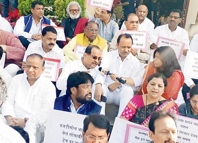 Opposition leader Radhakrishna Vikhe Patil, NCP leader Ajit Pawar and others stage a protest on the footsteps of Vidhan Bhavan in Nagpur