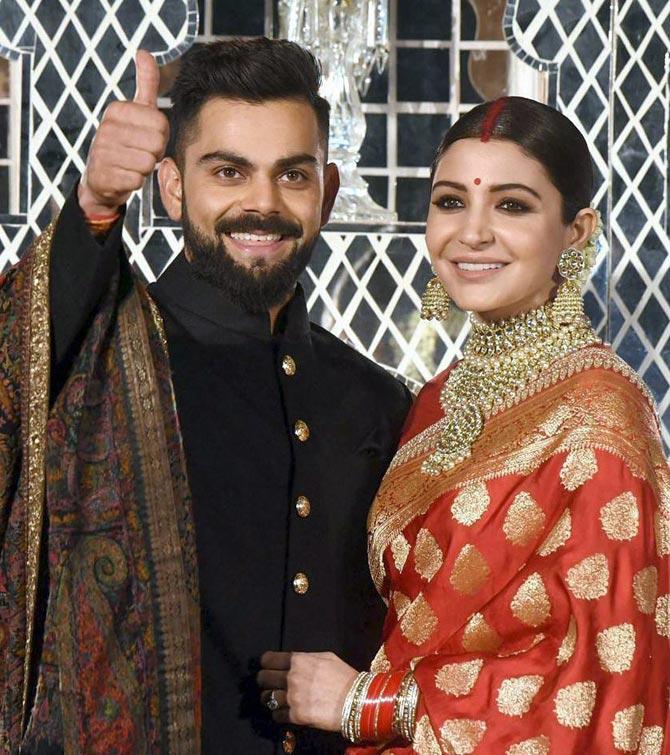 Indian cricket team captain, Virat Kohli and his wife actress Anushka Sharma during their wedding reception, in New Delhi on Thursday. Pic/PTI