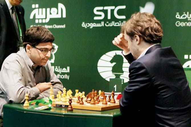 Viswanathan Anand (left) and Vladimir Fedoseev compete during the  World Rapid Chess Championships in Riyadh yesterday. Pic/Getty Images