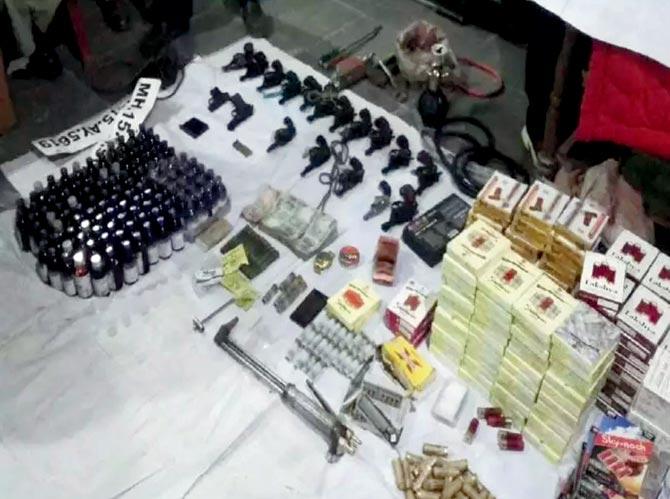 The 24 rifles and 17 pistols; the over 4,000 bullets and 10 bullets of 0.32 bore that were seized from the vehicle intercepted by the police on the Nashik highway