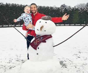 Andy Carroll gets into festive mode by building snowman for son Arlo