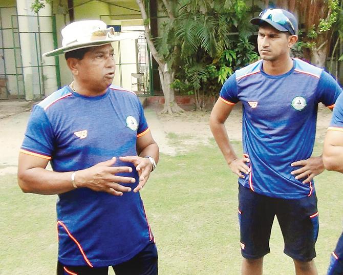Vidarbha coach Chandrakant Pandit (left) and batsman Ganesh Satish at VCA Stadium in Jamtha recently