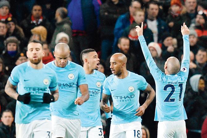 Manchester City players celebrate a goal against Manchester United during an EPL match at Old Trafford in Manchester on Sunday. pic/AFP
