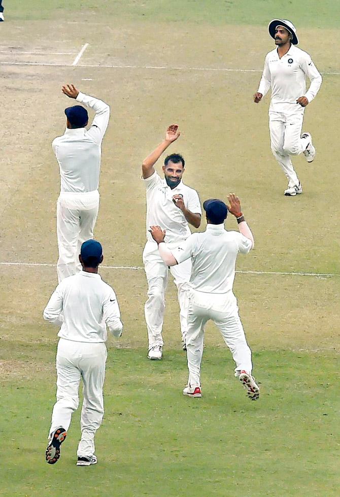 Indias Mohammed Shami celebrates the wicket of Sri Lankan Sadeera Samarawickrama during the fourth days play of the Kotla Test yesterday. PIC/PTI