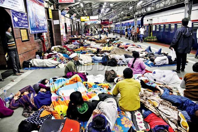 Ambedkar followers were seen resting at Dadar railway station last night, as all the schools where people had been moved to, were full. Pics/ Pradeep Dhivar