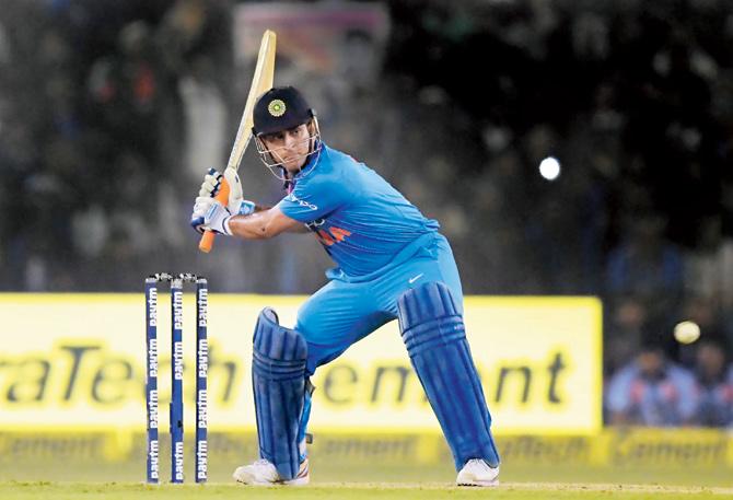MS Dhoni gets into position to hit a boundary during his 22-ball 39 knock against Sri Lanka in the first T20 International at the Barabati Stadium in Cuttack yesterday