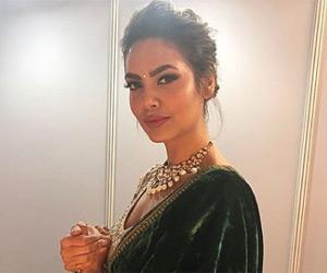 Esha Gupta looks resplendent in this green velvet saree
