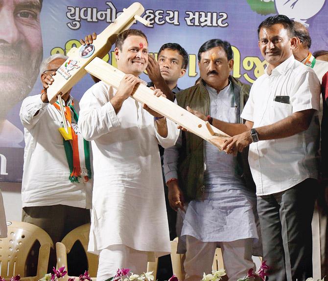 Rahul Gandhi being presented a model plough by his supporters during a public meeting in Amreli, Gujarat, on Wednesday. Pic/PTI