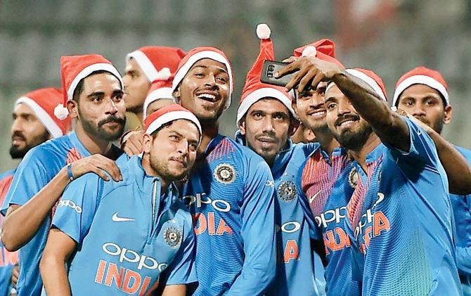 The Indian team celebrate their T20I series victory against Sri Lanka after the final match at Wankhede Stadium on Sunday. Pic/PTI