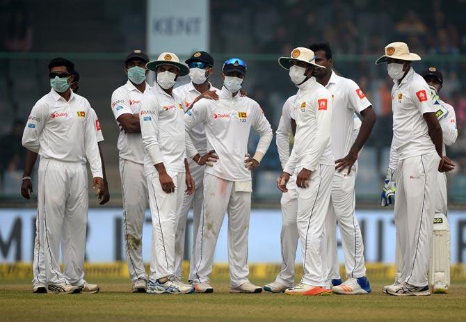 Sri Lanka cricket players wearing masks in an attempt to protect themselves from air pollution at the Feroz Shah Kotla Cricket Stadium