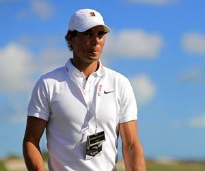 Nadal watches Tiger tee off in Bahamas
