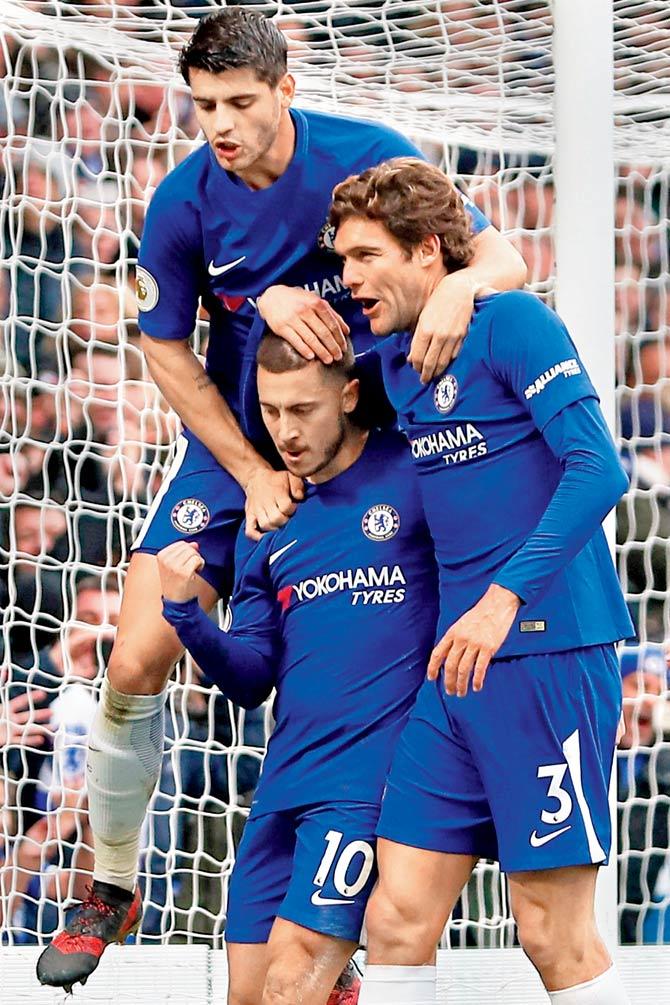 Chelseas Eden Hazard (centre) celebrates with his teammates after scoring his second goal from the penalty spot v Newcastle. Pic/AFP
