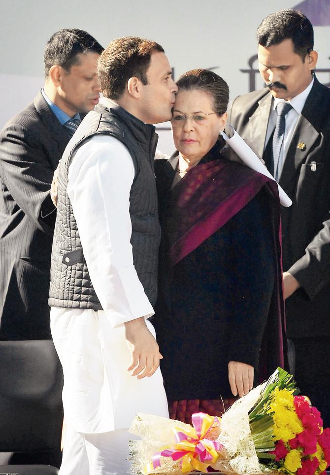 Congress chief Rahul Gandhi greets mother and predecessor Sonia Gandhi after her speech during the grand elevation event in New Delhi 