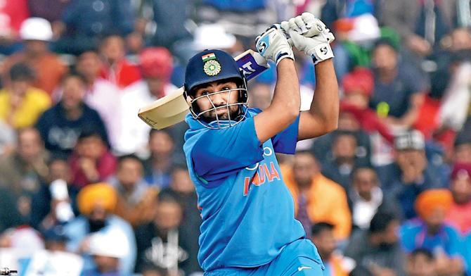 Indias Rohit Sharma en route  his unbeaten 208 against SL at Mohali on Wednesday. pic/pti 