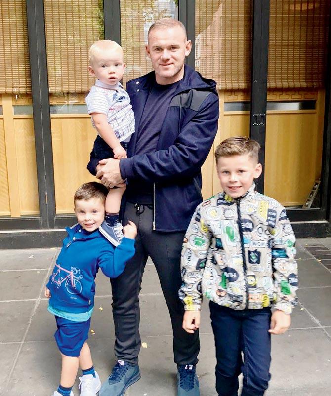 Rooney with his sons Kai, Klay and Kit. Pic/Wayne