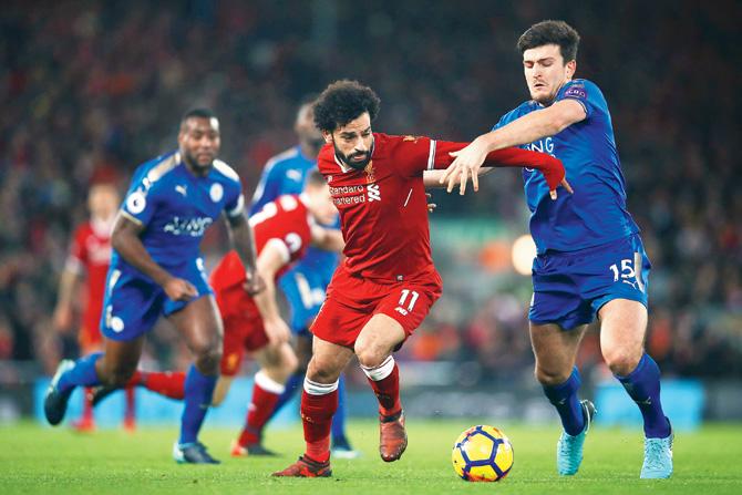 Liverpools Mohamed Salah (in red) vies for the ball against Leicester at Anfield on Saturday. Pic/Getty Images