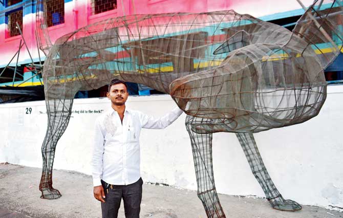 Fish auctioneer Sandeep Mhaske with Sassoon Dog by Faizan Patankar