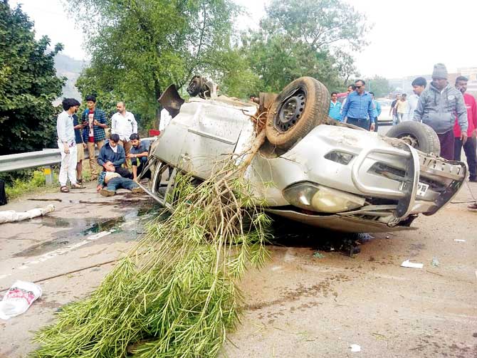 The overturned Innova, which was carrying nine people, at the accident spot on Mumbai-Pune Expressway