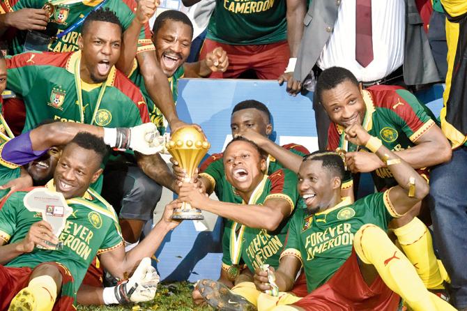 Cameroon players pose with the Africa Cup of Nations trophy after beating Egypt 2-1 in the final on Sunday. Pic/AFP
