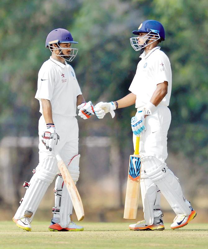 India A batsmen Priyank Panchal (left) Shreyas Iyer chat during their 159-run partnership for the second wicket on Day Two of the warm-up tie against Bangladesh at Hyderabad yesterday. Pic/AFP