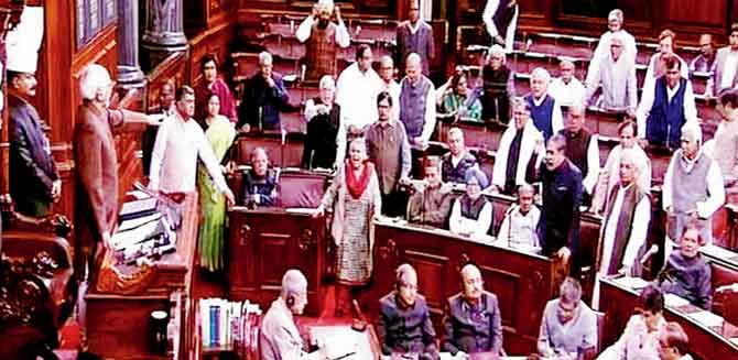 Vice President Hamid Ansari pacifies agitated Congress members after Modi’s comments in the Rajya Sabha. Pic/PTI