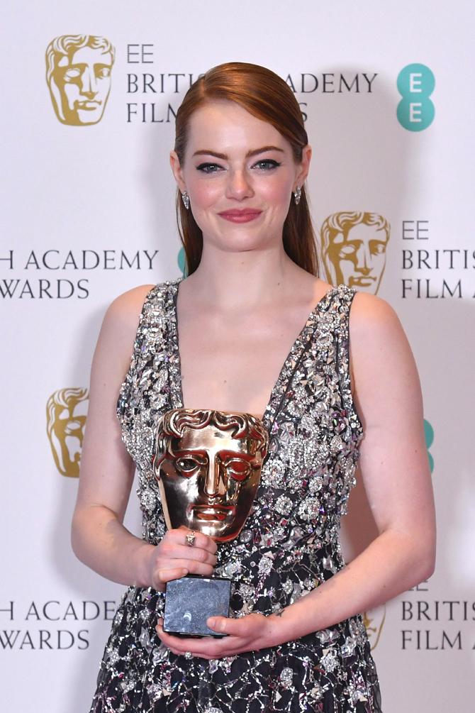 US actress Emma Stone poses with the award for a Leading Actress for her work on the film 