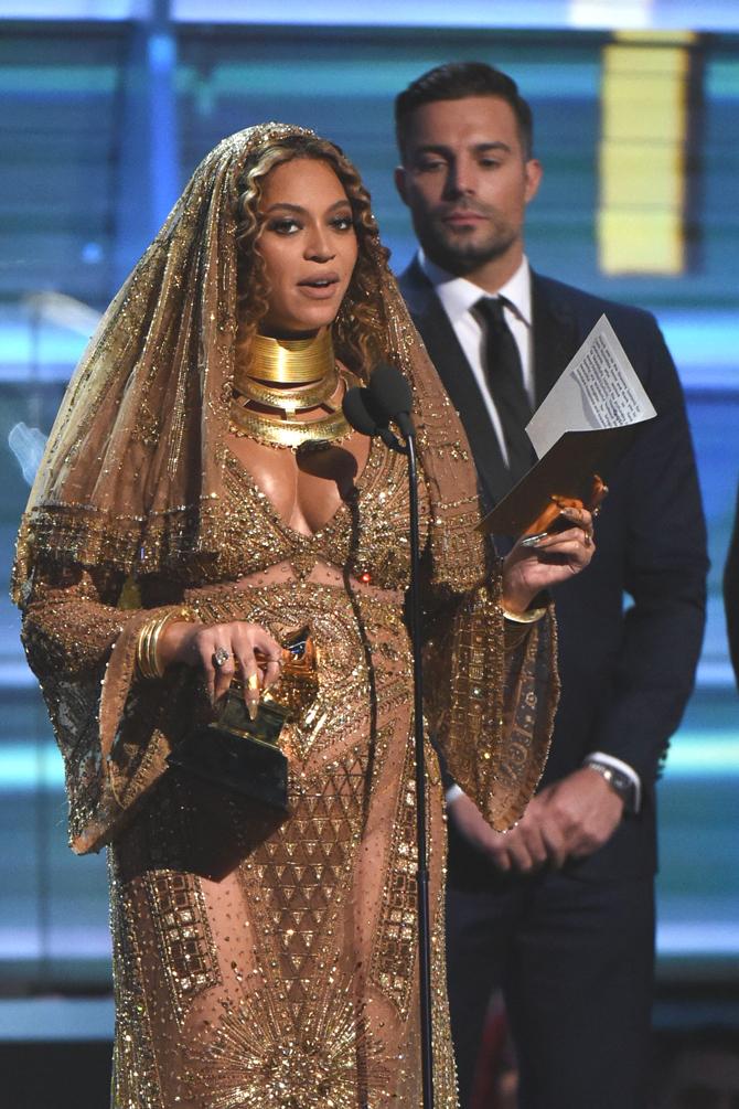Beyonce receives a Grammy onstage during the 59th Annual Grammy music Awards on February 12, 2017, in Los Angeles, California. Pic/AFP