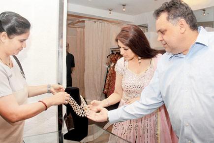 Sonali Bendre checks out a neckpiece at a jewellery launch