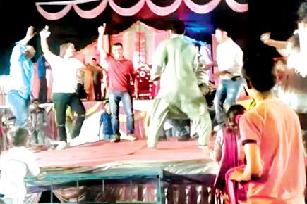 Knotty affair: Policemen dance to chainsnatcher's tune at wedding party