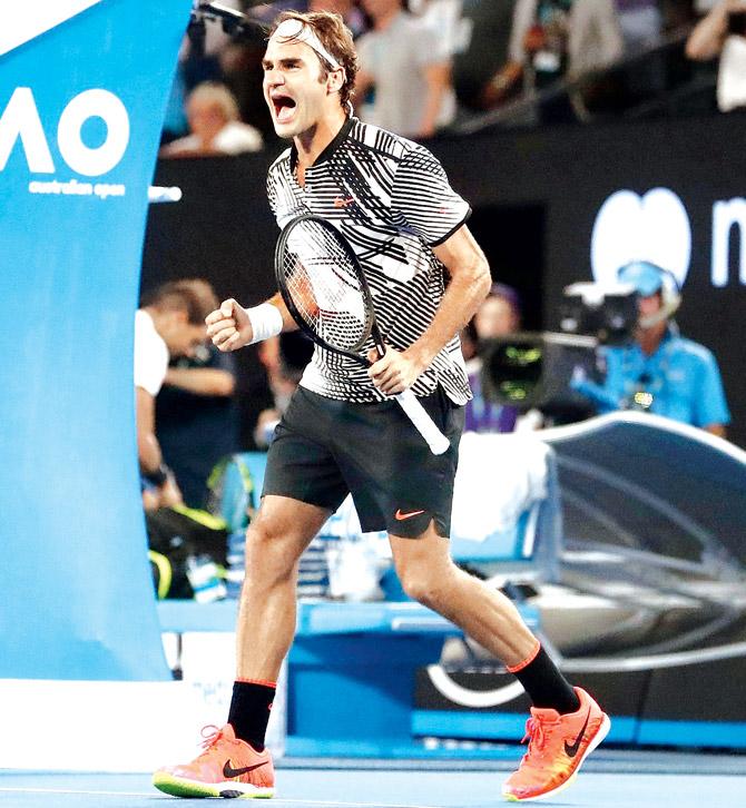 Roger Federer celebrates his victory against Spain’s Rafael Nadal during the men