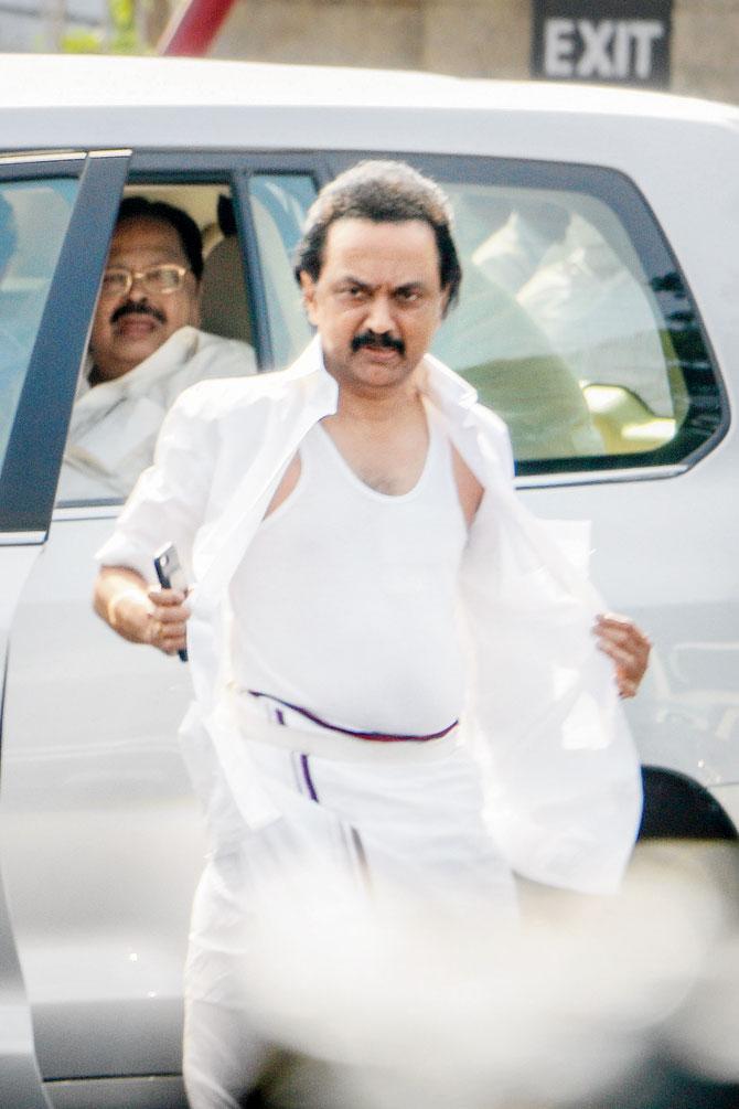 Opposition leader MK Stalin displays his torn shirt after the ruckus in the Assembly. Pic/PTI