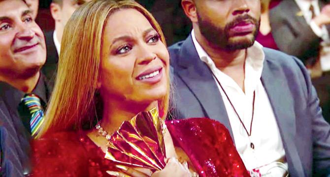 dedicated her Album of the Year award to fellow nominee Beyonce Knowles in her acceptance speech, and showered praise on Knowles, who was tipped to win. She then broke the gramophone trophy into half to share it with Knowles who was in tears throughout Adele