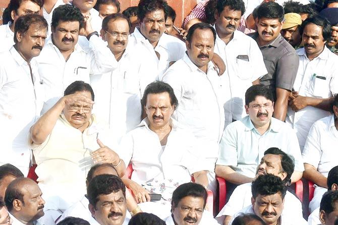 Opposition DMK stages a protest led by working president M K Stalin (Centre, sitting) on Saturday. Pic/PTI