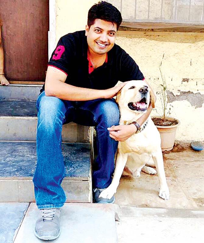 Deputy Commissioner of Police Amit Kale and his five-year old Labrador Sam