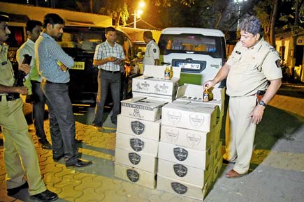 Police seize 21 cartons of alcohol from two abandoned SUVs in Malad