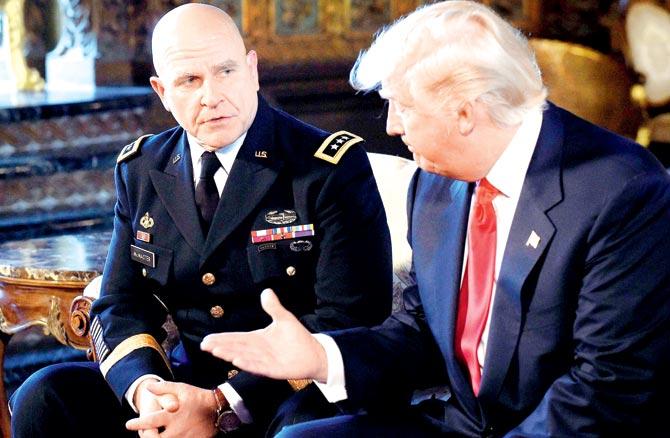 President Donald Trump reaches out to shake hands with Army Lt. Gen. H.R. McMaster. Pic/AFP