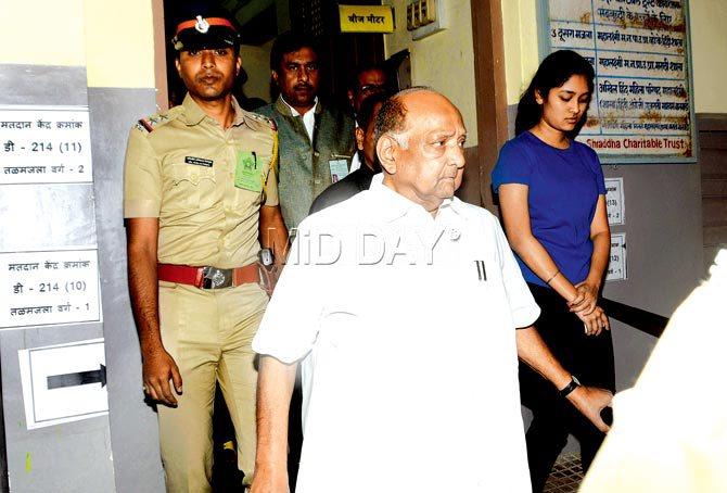 NCP chief Sharad Pawar exits the polling booth after casting his vote for the BMC elections. Pic/Bipin Kokate