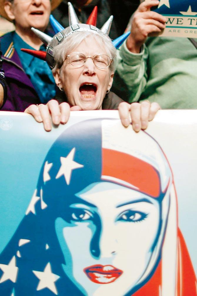 A woman protester during a rally called ‘I Am A Muslim Too’ in a show of solidarity with American Muslims at Times Square. Pic/AFP