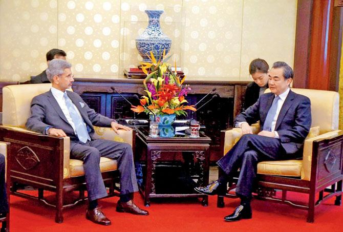 Foreign Secretary S Jaishankar talks to Chinese Foreign Minister Wang Yi in Beijing. Pic/PTI