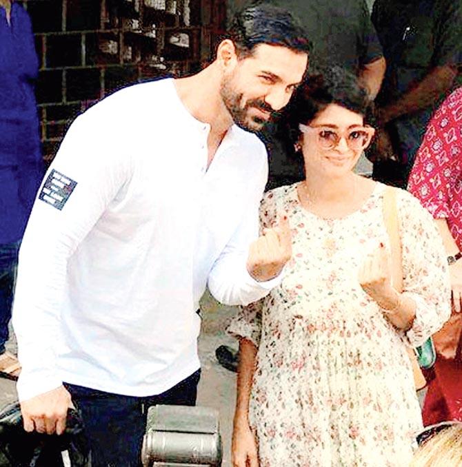 John Abraham and Kiran Rao show their inked fingers after casting their votes at the recently held BMC elections. Pic/PTI
