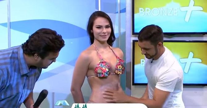 Bikini model slaps presenter after he tries to rub her butt on a TV show